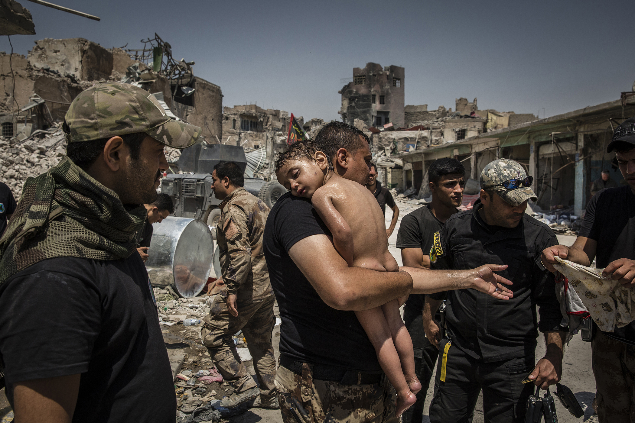 The Battle for Mosul - Young Boy Is Cared for by Iraqi Special Forces Soldiers