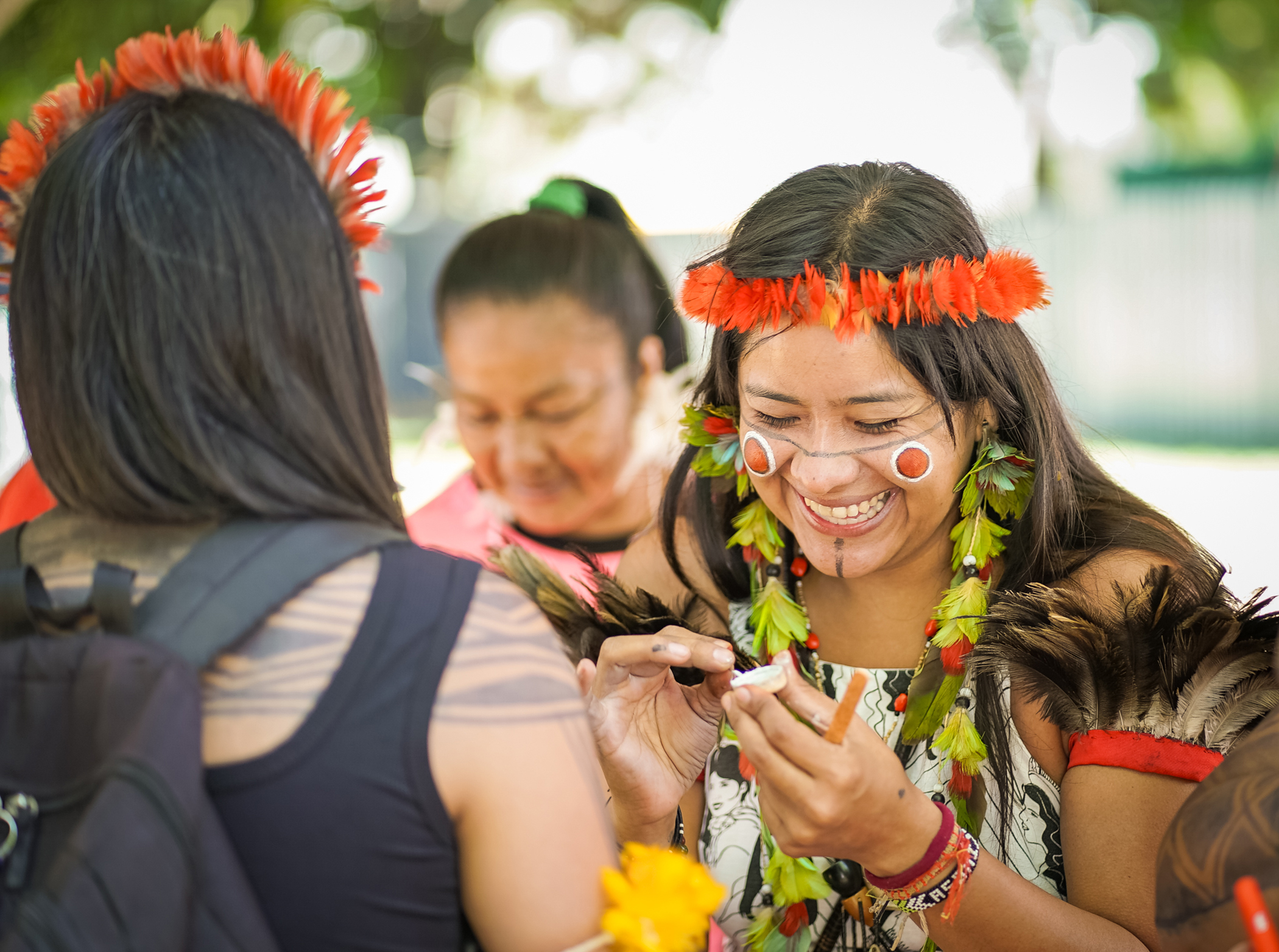Global Citizen Prize winner and Indigenous climate activist, Taily Terena, helps community members get ready for the Free Land Indigenous Camp event, 2025. | Homero Flávio for Global Citizen