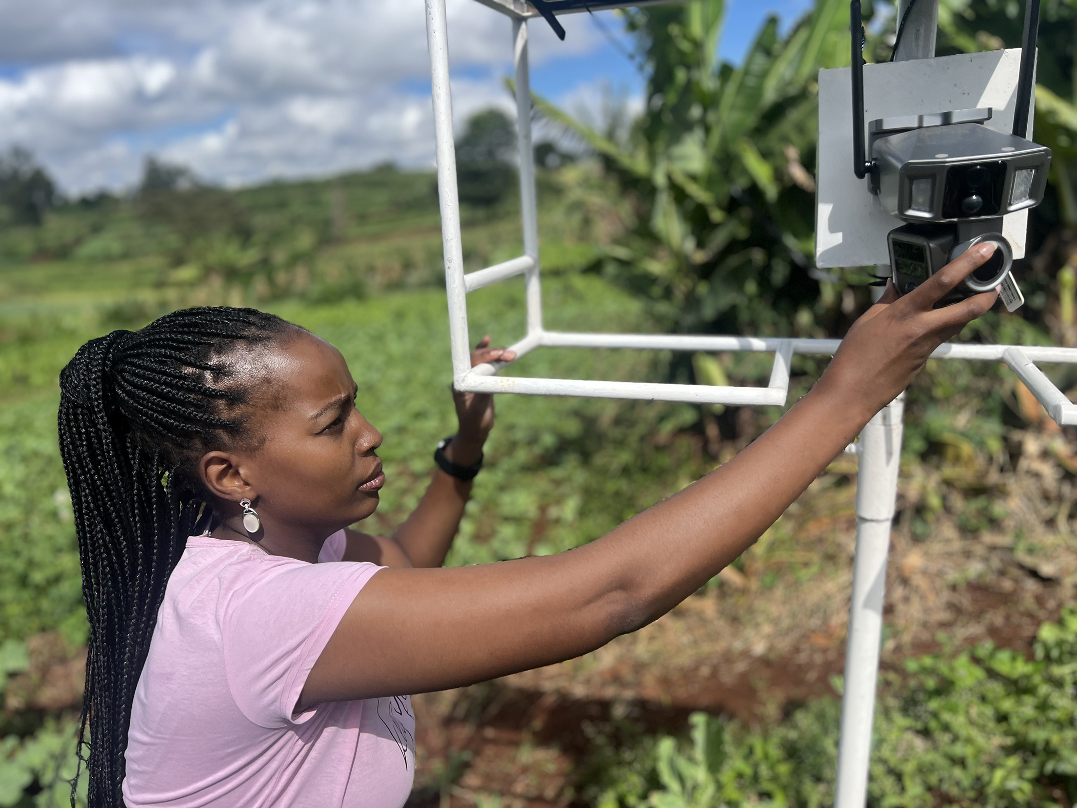 Esther Kimani demonstrates the AI-powered camera system designed to detect pests on smallholder farms across Kenya. Image: John Kunga for global Citizen