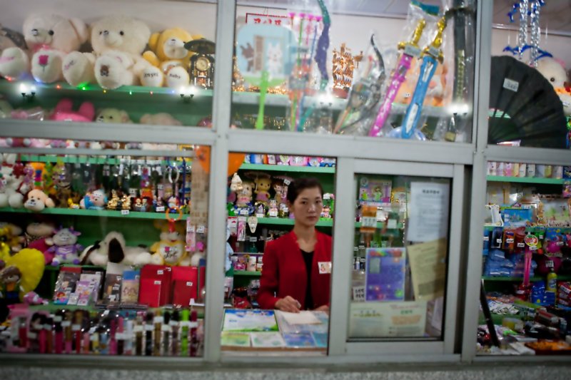 shop worker in Pyongyang skeptical woman NK shop.jpg